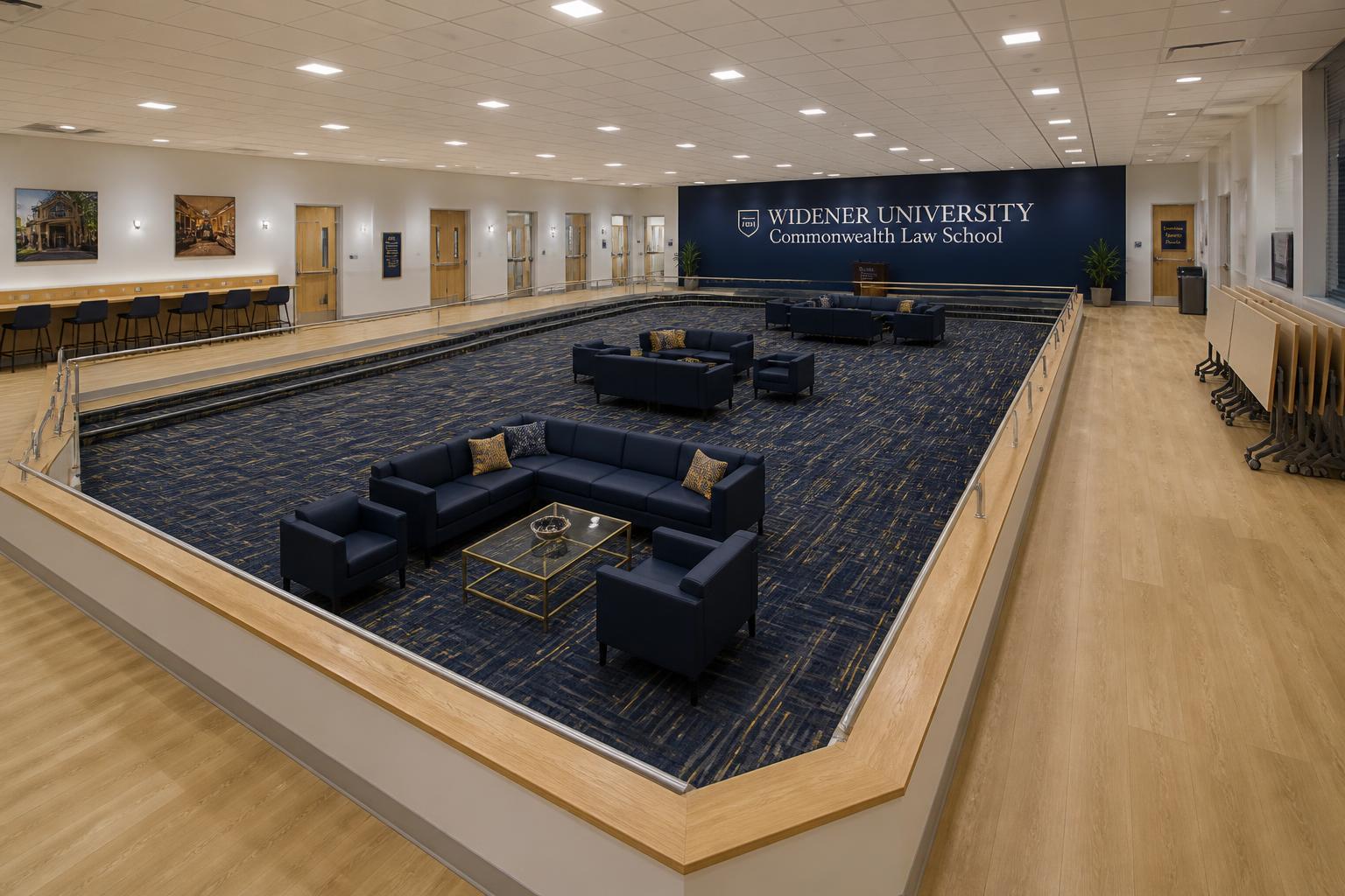 Overview of the Commons concept with navy Allermuir sofas, brass coffee table and Widener navy feature wall